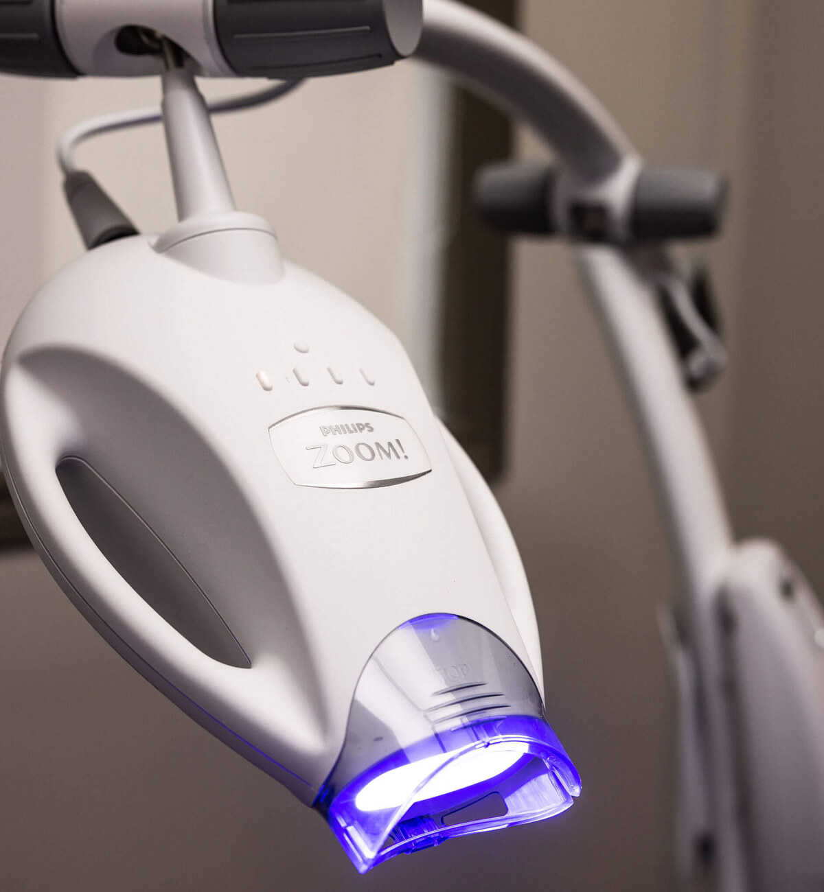 Philips ZOOM professional teeth whitening lamp with blue LED activation light at Kurly's Pearlies dental hygiene clinic in Georgetown, Ontario